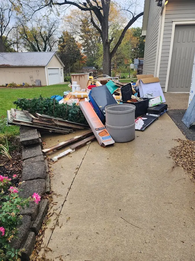 Dumpster being loaded with debris for 3 Yard Dumpster Rental in Minerva